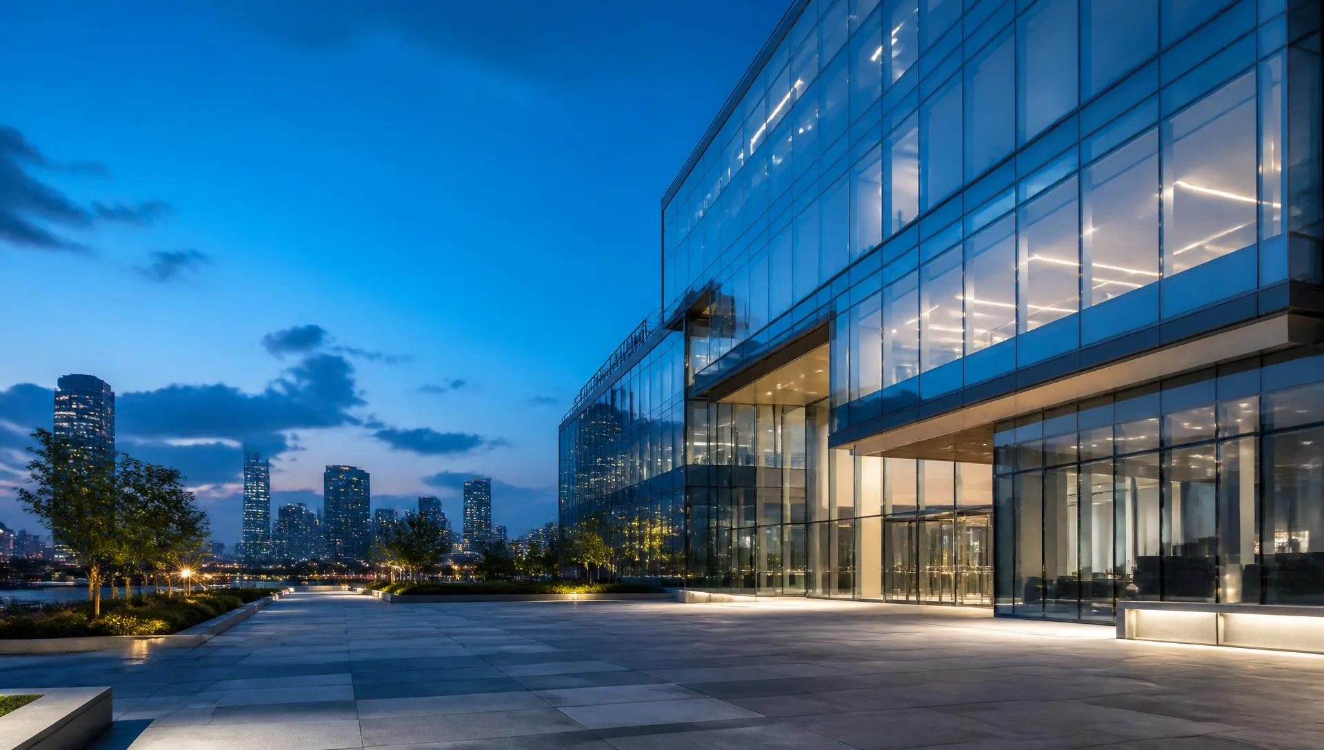 Modern glass enterprise technology campus at blue hour